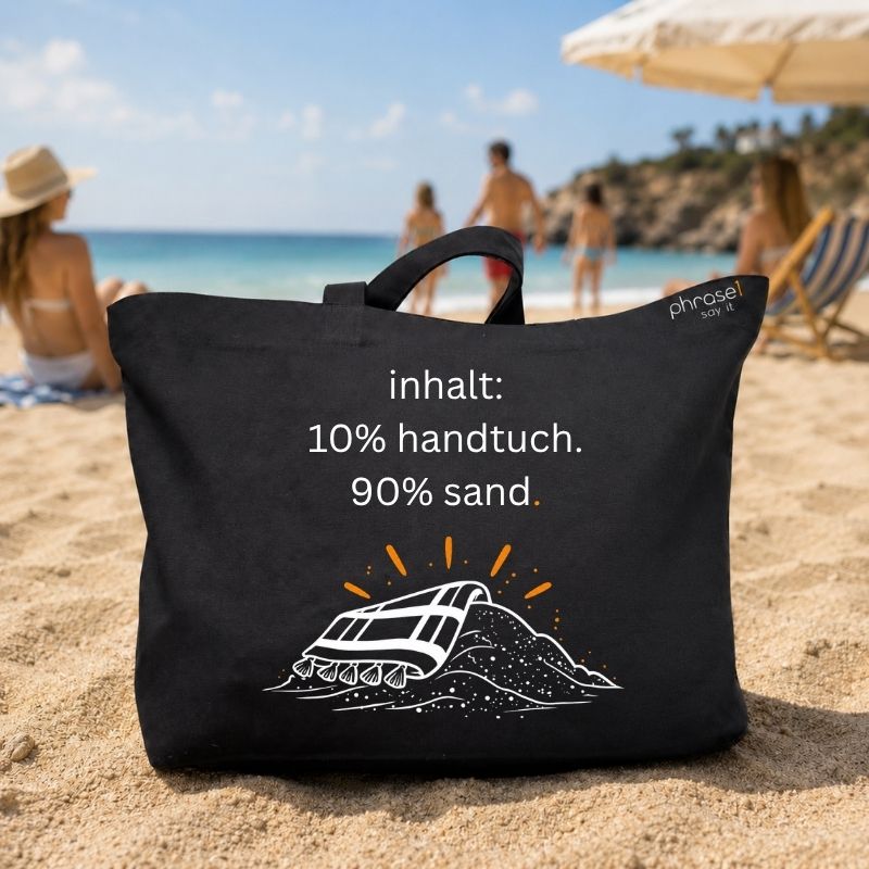 Premium Shopper mit Spruch „inhalt: 10% handtuch. 90% sand."